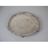 An Edward VII silver Salver with vacant rococo cartouche, gadroon rim on ball and claw feet,