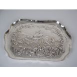 An Edward VII silver Dressing Table Tray embossed nude bathers surrounded by flowers and fruiting