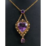 An Amethyst Necklace set heart-cut stone within pierced frame suspended below round stone and