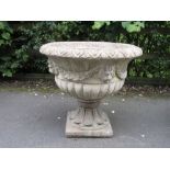 A large composition Garden Urn on pedestal base with design of lion masks and drapery, 2ft 3in