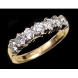 A Diamond seven stone Ring claw-set brilliant-cut stones in 18ct white and yellow gold, ring size M