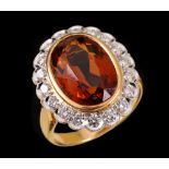 A Citrine and Diamond Cluster Ring rubover-set oval-cut citrine within frame of pavé-set brilliant-