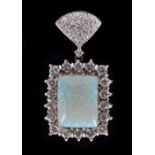 An Opal and Diamond Pendant claw-set square opal cabochon within a frame of peg-set brilliant-cut