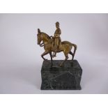 A gilt metal Figure of a Roman style figure on horseback, on green veined marble plinth, 12in