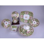 A Coalport part Tea Service decorated floral reserves within apple green and gilt ground, viz: eight