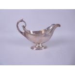 A Victorian silver large Sauce Boat engraved bird crest and monogram, beaded rim, leafage scroll