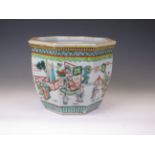 A Chinese famille verte porcelain octagonal Cache Pot, decorated with court figures on terraces, the