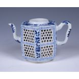 A Chinese reticulated blue and white porcelain Teapot, Kangxi, of double walled hexagonal form, four