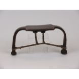 A Bari Headrest, Uganda/South Sudan, the square platform above bowed legs united by twisted