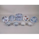 Four Chinese Teabowls and Saucers, 18th Century, comprising a pair of clobbered blue and white bowls