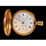 An 18ct gold cased Hunter Pocket Watch by Waltham, the white enamel dial with roman numerals and