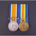 Pair: BRITISH WAR & VICTORY MEDALS (1941 Pte. A.J. Henderson. Guernsey L.I).Mounted court style.With