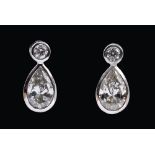 A pair of Diamond Drop Earrings each rubover-set brilliant-cut stone above pear-cut stone, estimated