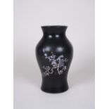 A Chinese lacquer Vase of baluster form, decorated mother of pearl, 9in H