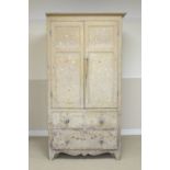 A 19th Century painted pine Cupboard with pair of solid panelled doors above two short and one