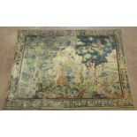 A 17th Century Flemish Verdure Tapestry, with figures gathering flowers below an angel and floral