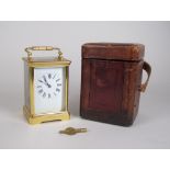 A brass cased Carriage Clock in leather case, 5 1/2 in H