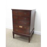 A bowfront mahogany Cabinet of five long drawers containing cabinet maker's fittings including