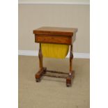 An early 19th Century rosewood Games/Work Table with fold-over top revealing chequers, backgammon