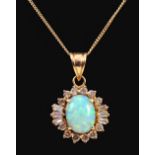 An Opal and Diamond Pendant claw-set oval opal cabochon within frame of peg-set brilliant and