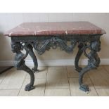 A French Empire style Console Table with red marble top with leafage and scroll decoration,