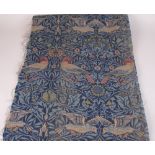 A length of antique William Morris woven Fabric, birds on blue ground, 9ft long x 22in wide