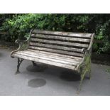 A cast iron Garden Bench with wooden slatted seat, 4ft 1in W