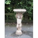 A composition Garden Bird Bath with cherub support, 2ft 4in H