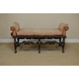 A William and Mary style Window Seat with roll ends, gadroon carved border on scroll supports, the