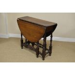 An early 18th Century walnut oval Gate-leg Table fitted single drawer on finely turned baluster