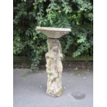A composition Bird Bath with cherub support, 2ft 8in H