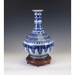 A Chinese blue and white porcelain Vase,18th/19th Century, of onion shape with straight everted lip,