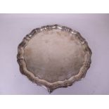 An Edward VII silver shaped circular Salver on four ball and claw feet, Sheffield 1903, 12 in D, and