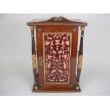 A 19th Century French Gem Collector's Cabinet in kingwood having gilt mounted door with fretwork