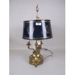 A brass three branch Table Lamp with lattice pierced drip tray and blue tollware shade 2ft H