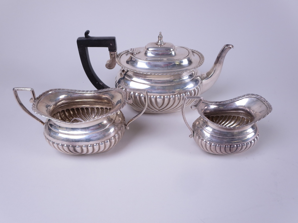 A Victorian silver three piece Tea Service of semi-fluted boat shape, Chester 1896