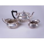 A Victorian silver three piece Tea Service of semi-fluted boat shape, Chester 1896