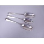 Two George I silver Table Spoons, hanovarian pattern with rat tail bowls, one with initials M.H.,