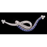 A Diamond and Sapphire Spray Brooch pavé-set round sapphires and eight-cut diamonds in white gold