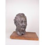 A patinated Bust of a Man on wooden plinth