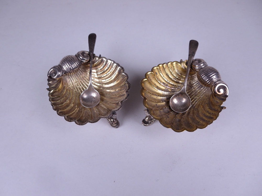 A pair of Victorian silver-gilt Shell Salts on dolphin supports, Birmingham 1873, maker: George