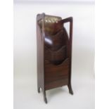 An Arts and Crafts Magazine Rack in mahogany with piercing to the back and sides, 3ft 2in H