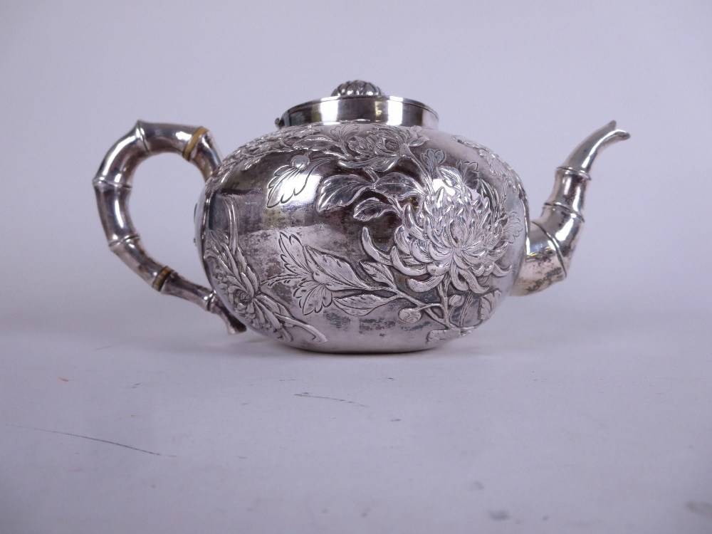 A Chinese silver three piece Tea Service decorated insects and chrysanthemum, the teapot and sucrier - Image 9 of 10