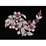 A Ruby and Diamond Flower Spray Brooch claw-set six round rubies among numerous claw and pavé-set