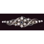 A Sapphire and Diamond Brooch pavé-set single round sapphire within numerous old and rose-cut