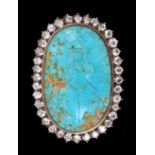 A Turquoise and Diamond Brooch, the oval sky-blue turquoise engraved figure wearing a crown,