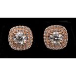 A pair of Diamond Cluster Earrings each claw-set brilliant-cut stone, approx 0.50cts, within