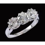 A Diamond three stone Ring claw-set graduated old-cut stones, estimated total diamond weight 2.