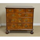 An 18th Century walnut Chest of Drawers, the cross-banded quartered top above three short and