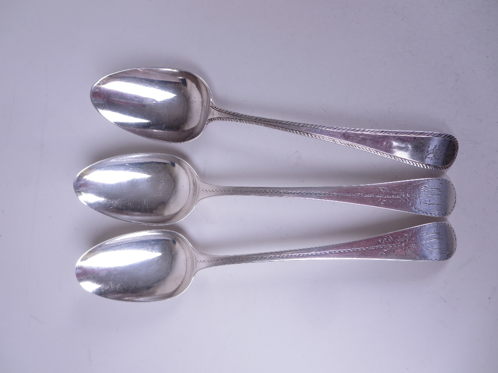 A pair of George III silver Table Spoons old english pattern with bright cut decoration and - Image 2 of 3